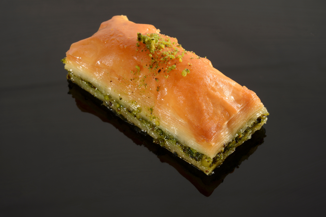 Pastry with green filling on a black background